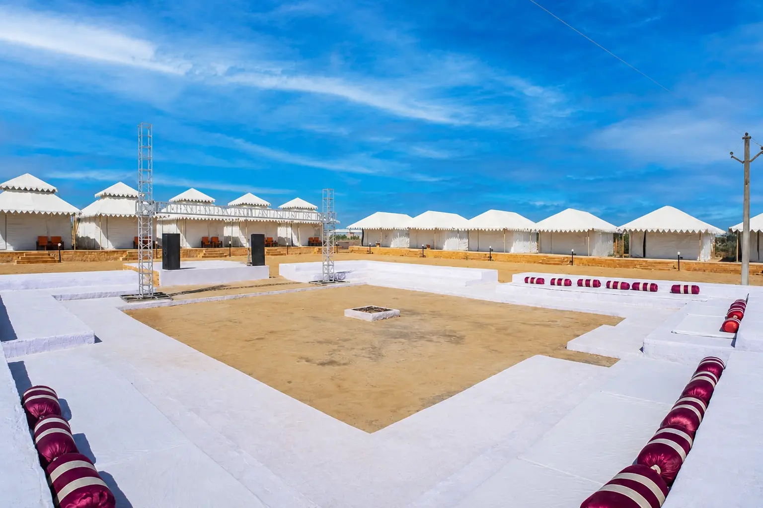 Dusk N Dunes desert camp exterior with tents at sunset