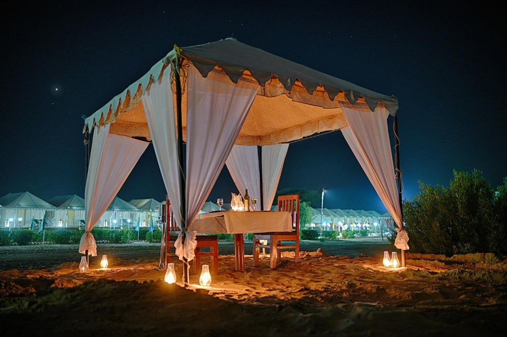 Dinner setup on the dunes at sunset, Dusk N Dunes