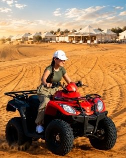 Quad biking on desert sand